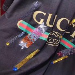  Gucci Oversize T-shirt with Gucci logo and shooting stars 492347