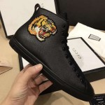 Gucci Leather high-top with tiger sneaker 451621