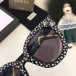 Gucci Cat eye acetate sunglasses with stars 470463-1011