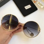 Gucci Round-frame metal sunglasses 506149